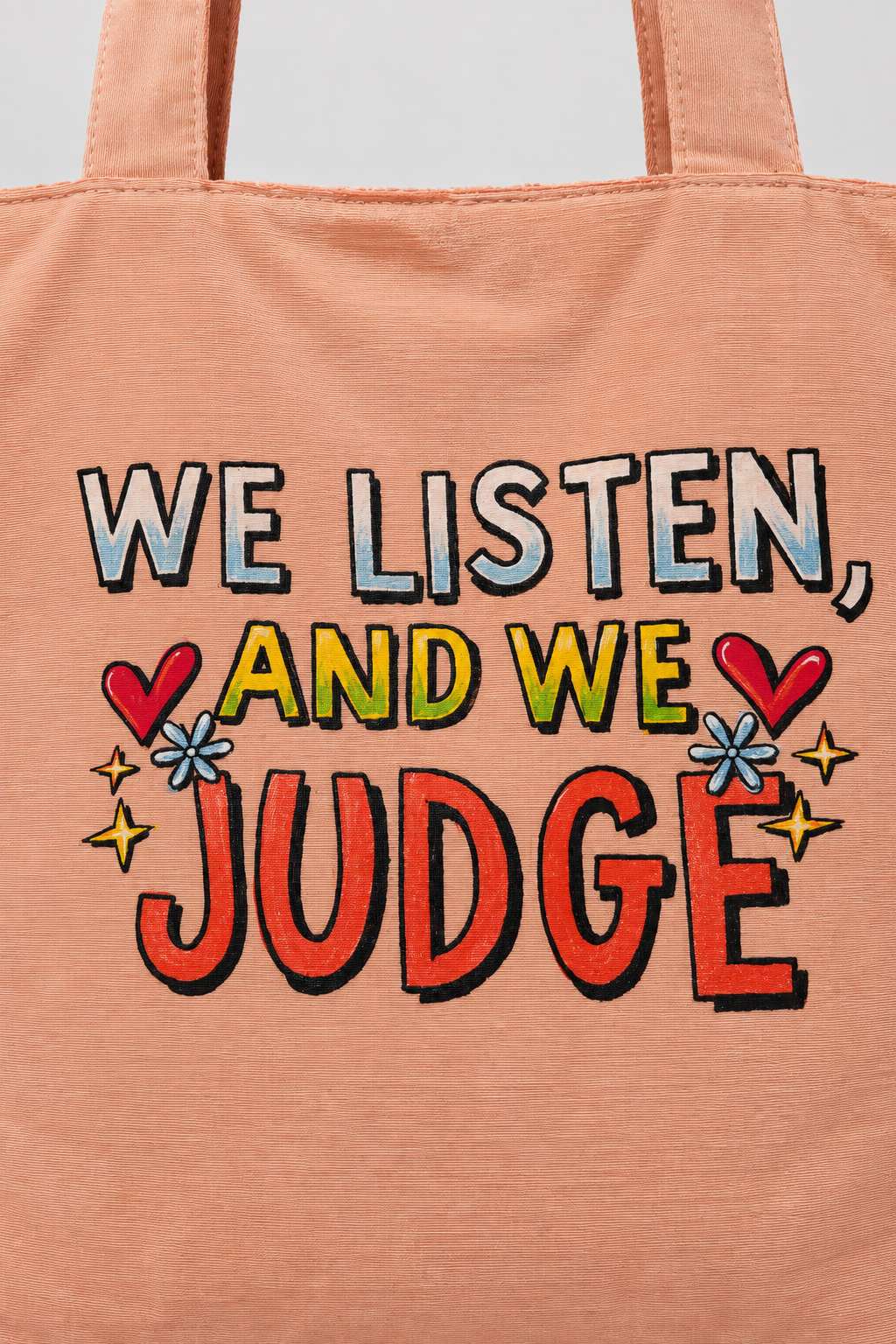 Close-up of the multicolor We Listen and We Judge artwork